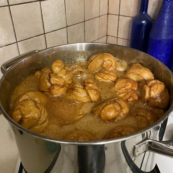 File:Browned teiglach boiling in honey.jpg