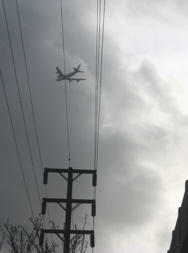File:Plane flying into clouds.jpg