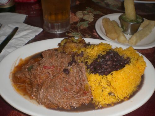 Cuban food with shredded flank steak